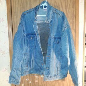 A JEAN JACKET WITH AN INDIAN ON THE BACK